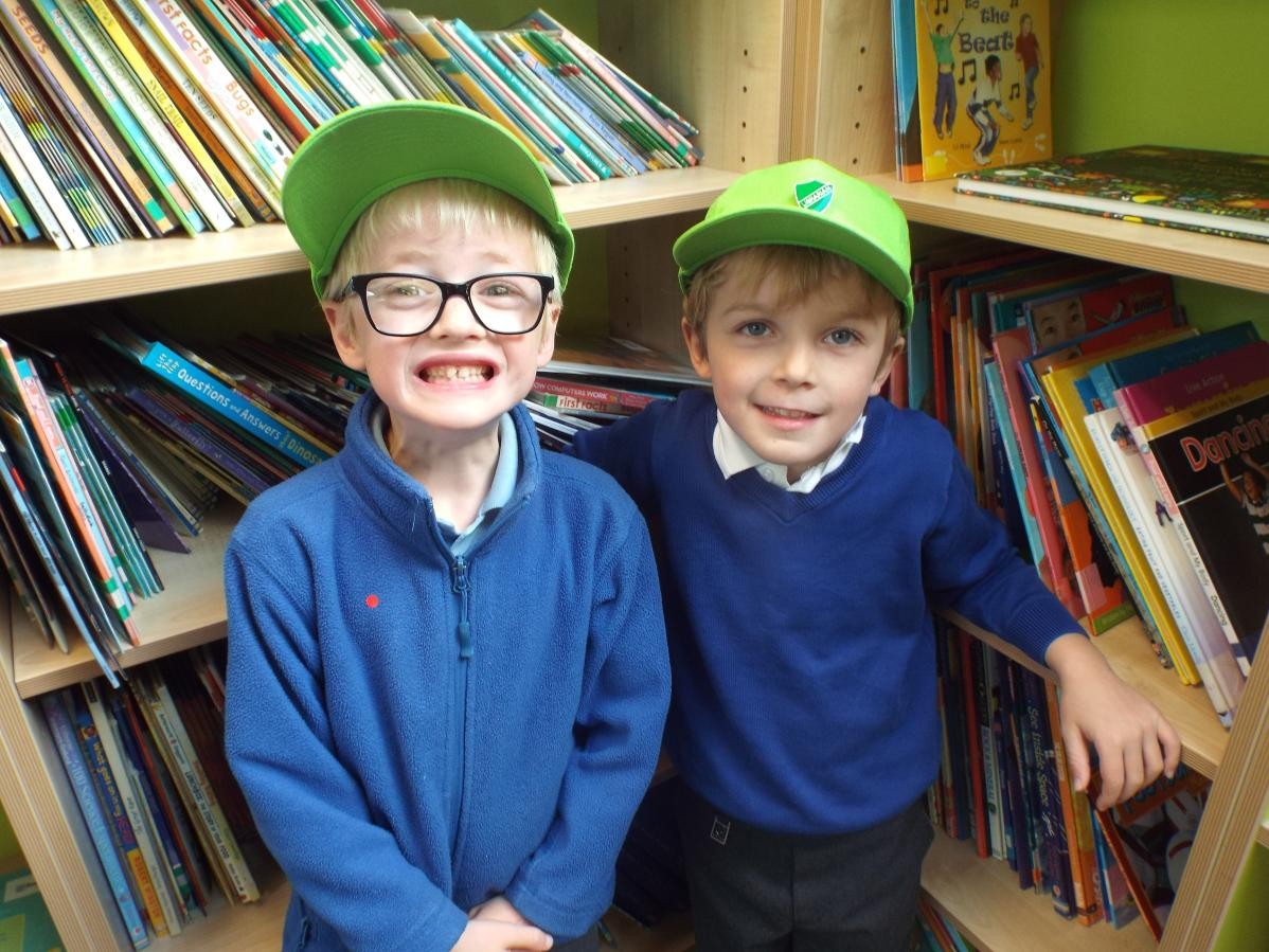 Two of our own new librarians who are responsible for tidying and sorting the books.