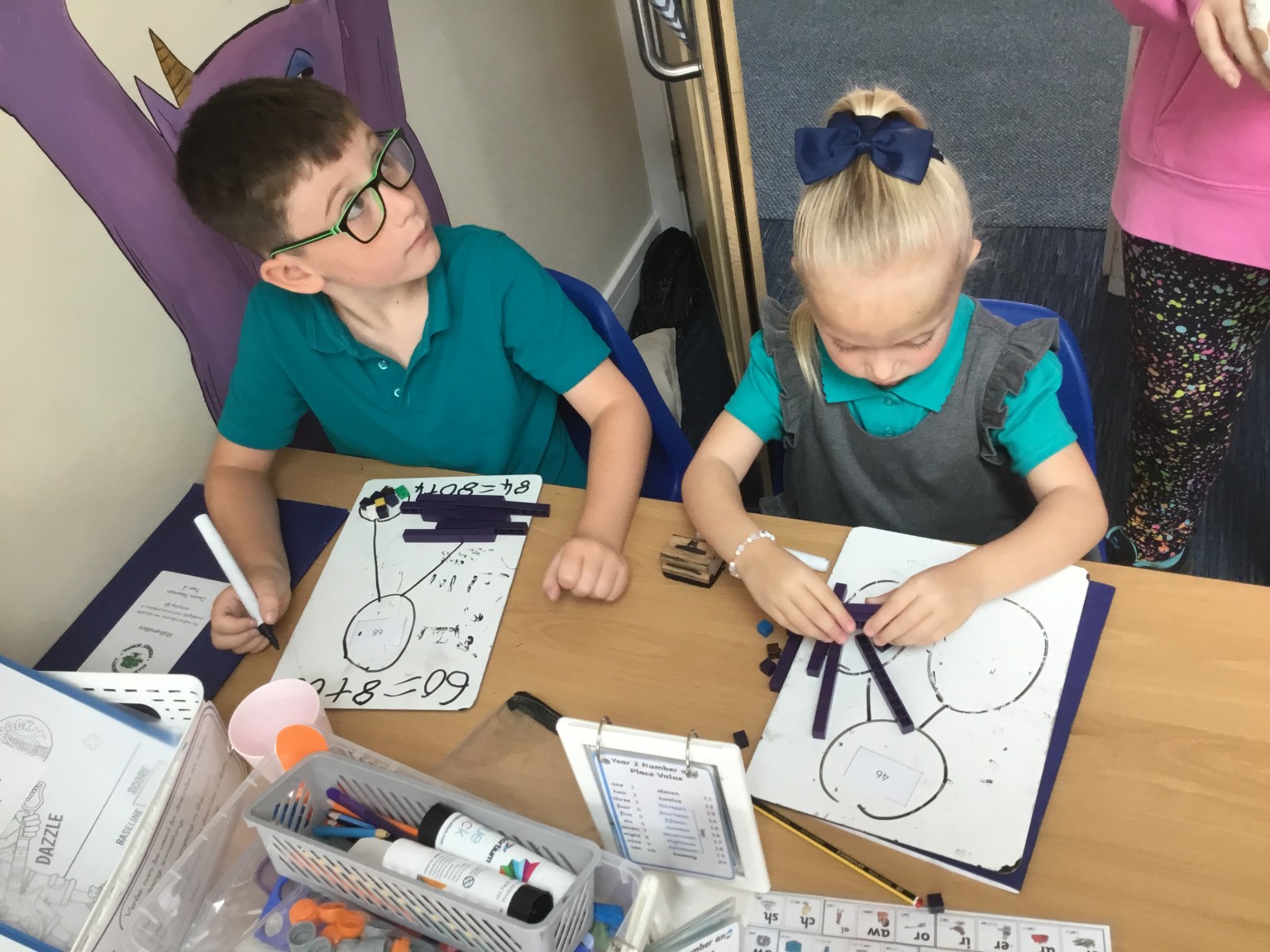 In maths we have been learning to partition 2-digit numbers. 