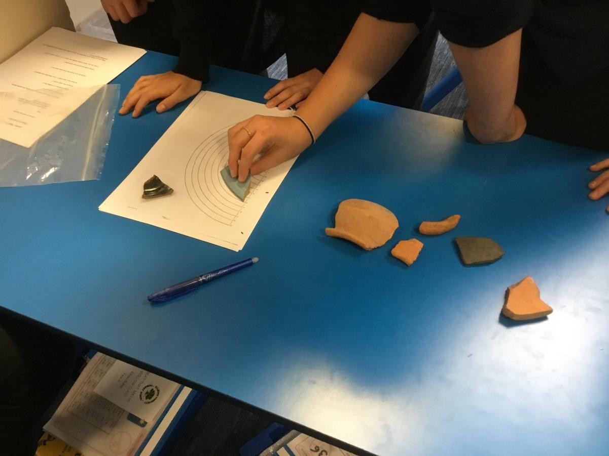 Comparing pieces of Roman pottery