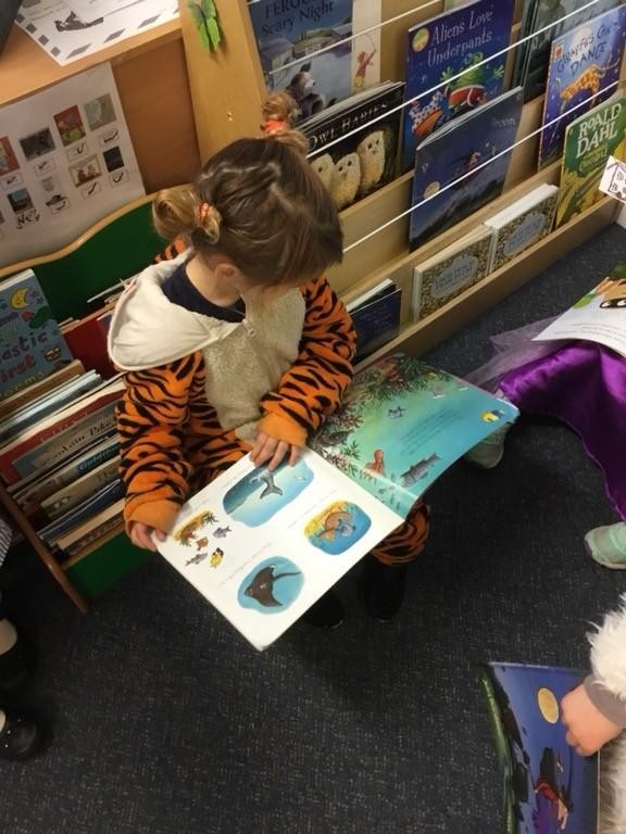 Child led learning in the 'Reading Garden'.