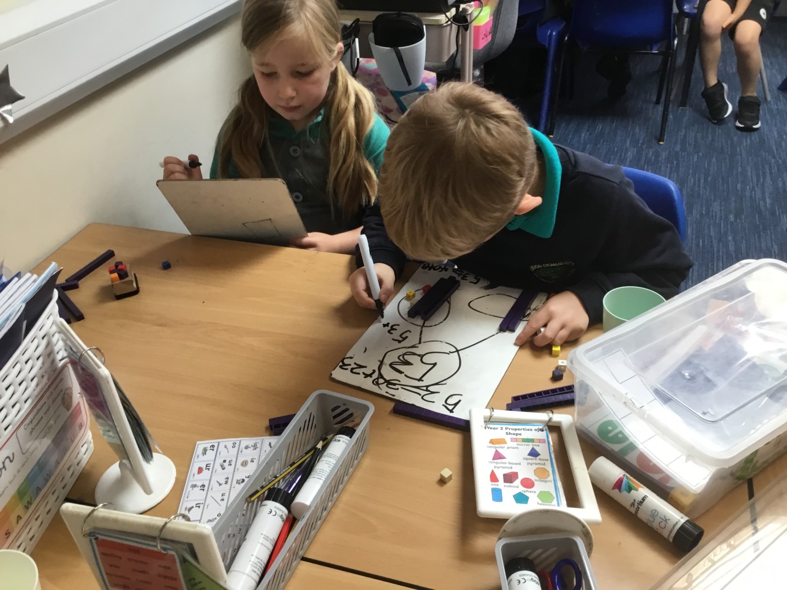 In maths we have been learning to partition 2-digit numbers. 