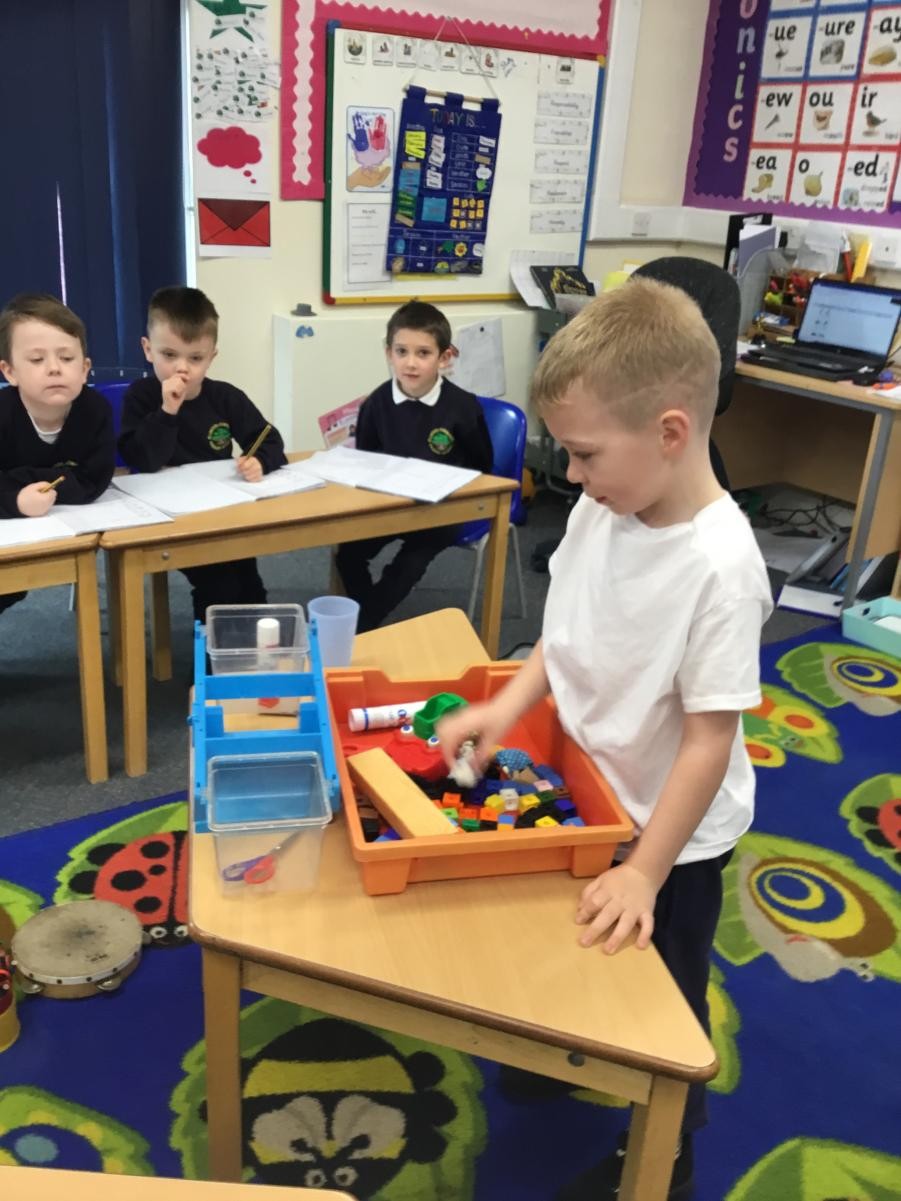 Using the language heavier and lighter to compare objects