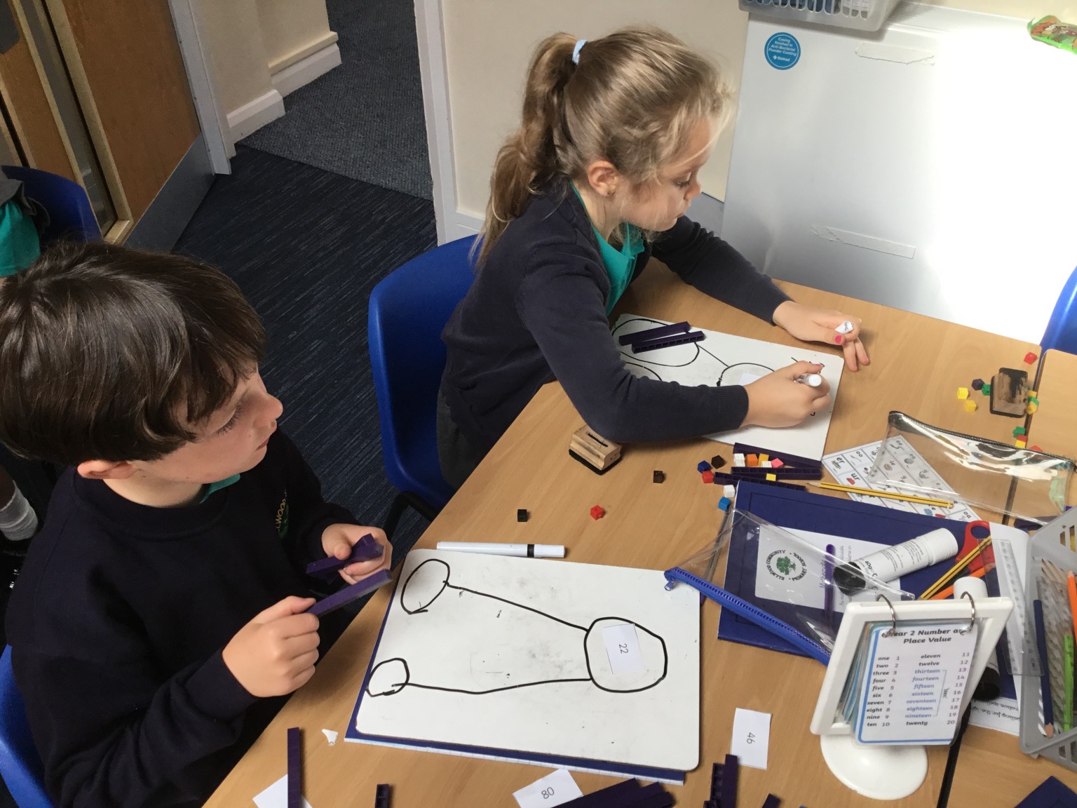 In maths we have been learning to partition 2-digit numbers. 