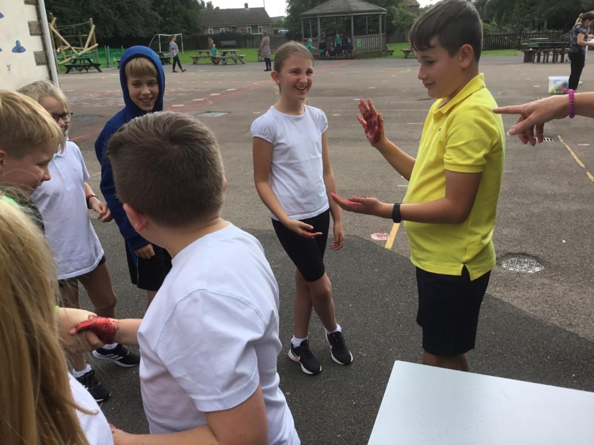 Hand hygiene - learning about the spread of harmful microbes. 
