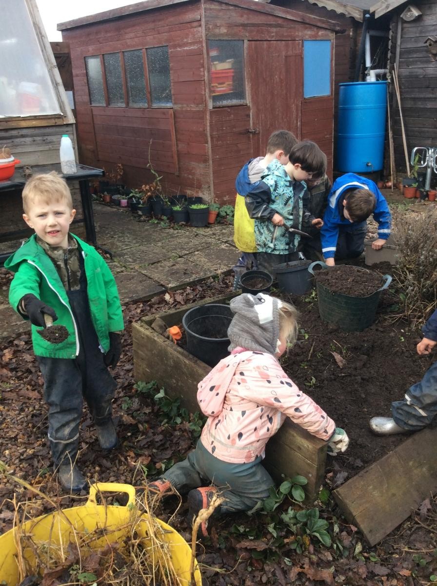 Digging over soil ready for replacing our raised bed.  