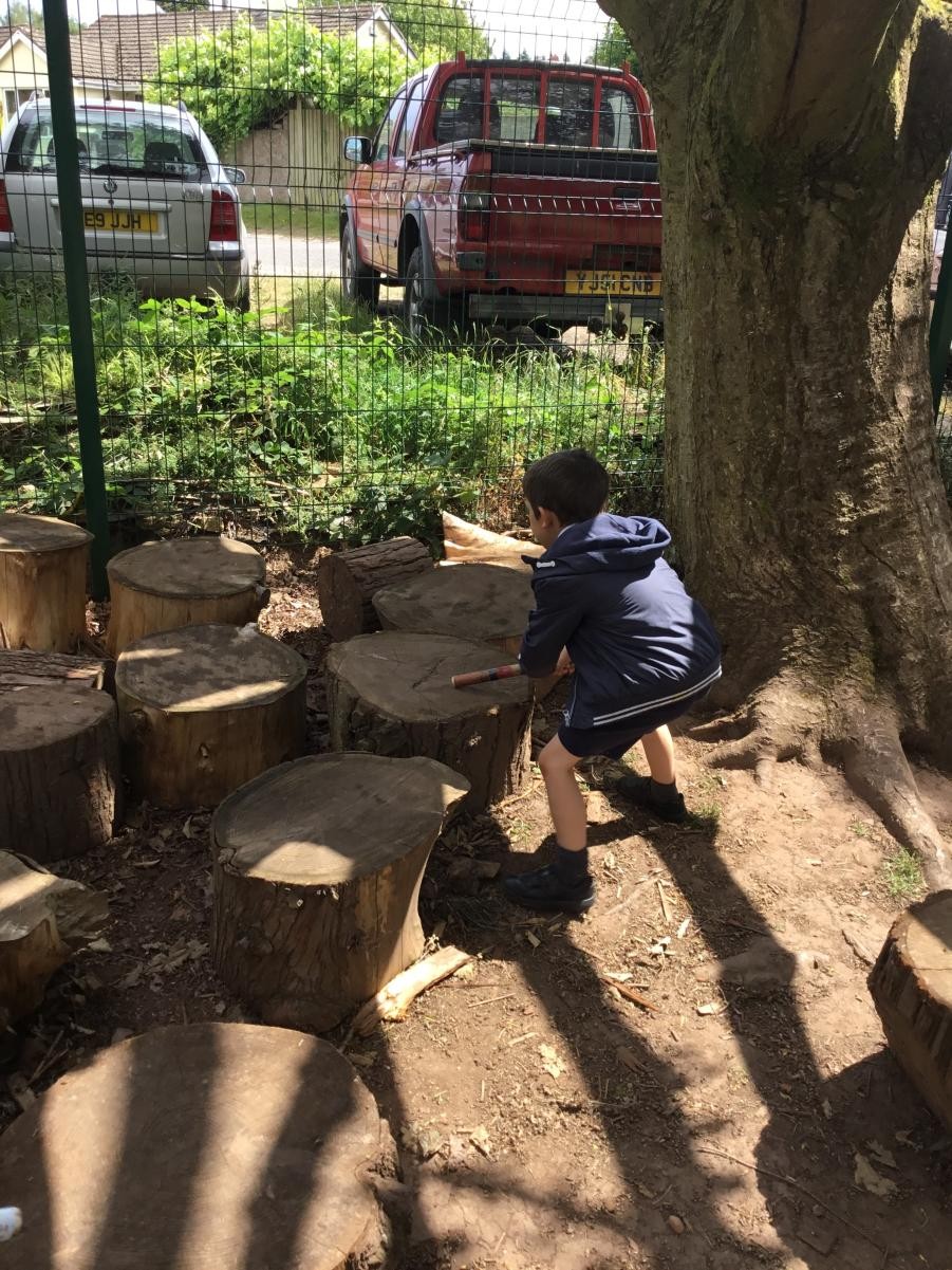 Drumming using natural materials. 