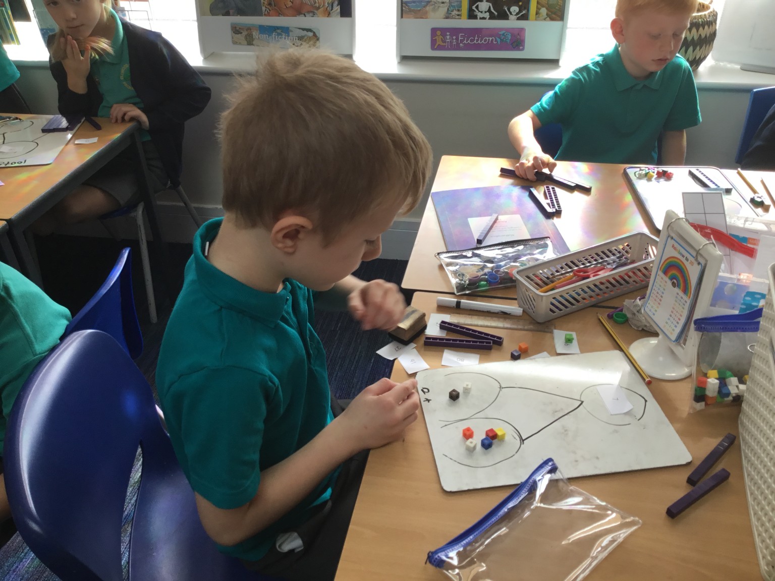 In maths we have been learning to partition 2-digit numbers. 