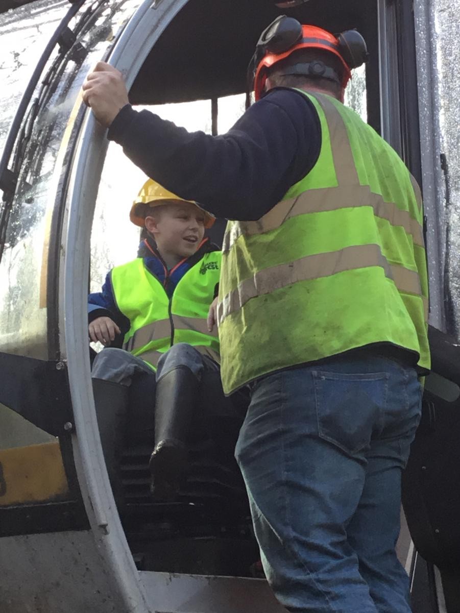 Trying out the forest harvesting machine 