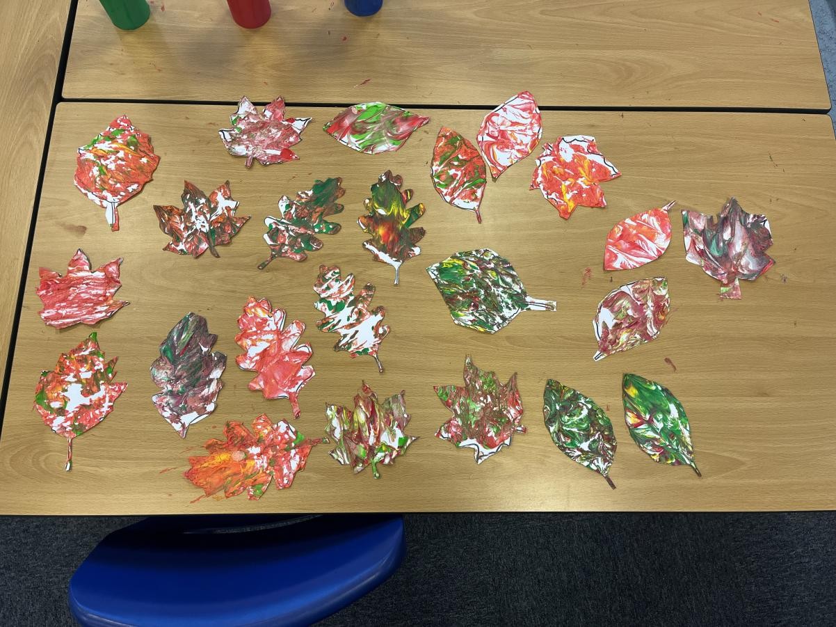 We were so excited about our autumn leaves! We pressed our leaf cut outs on to shaving foam and paint to create our marble effect. We love them!