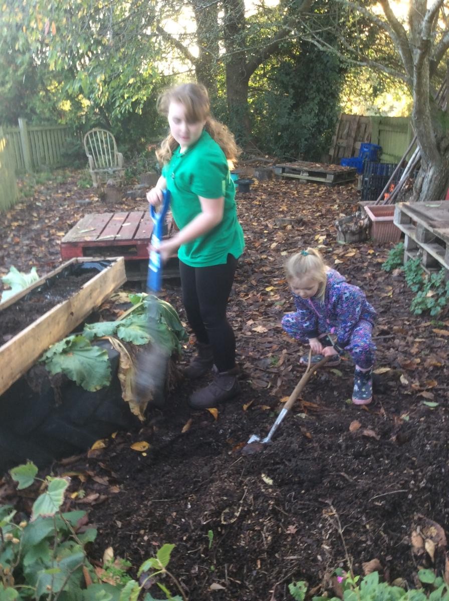 Creating new planters to improve the front of the school.