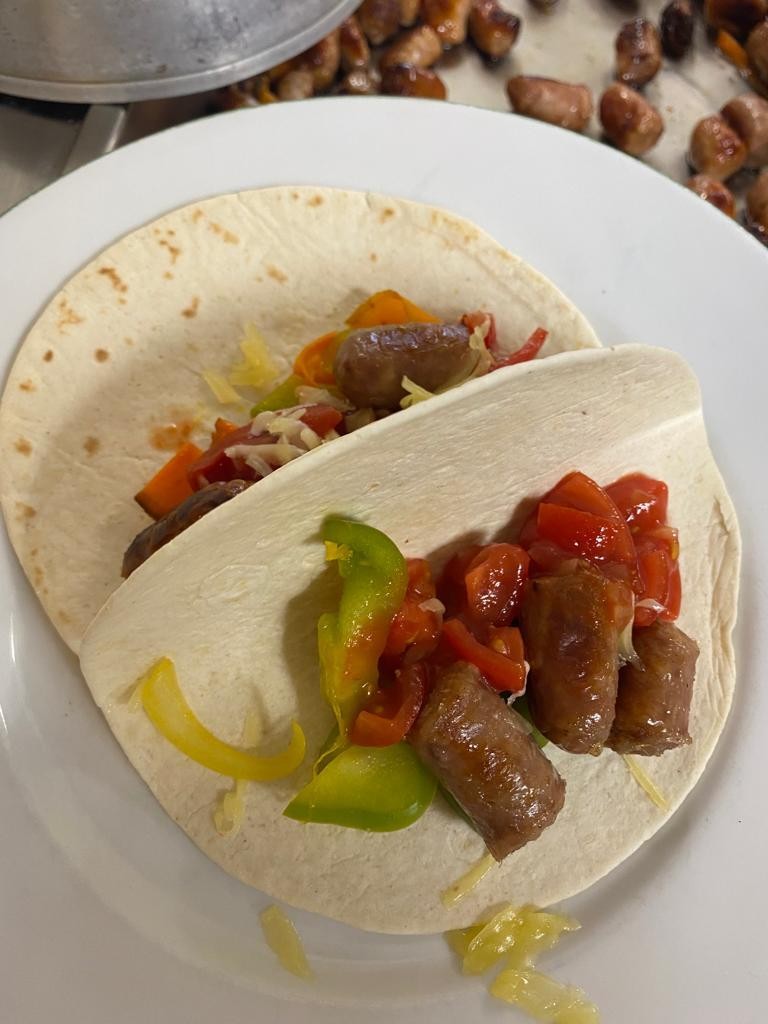 Sausage wraps with fresh vegetables and salsa