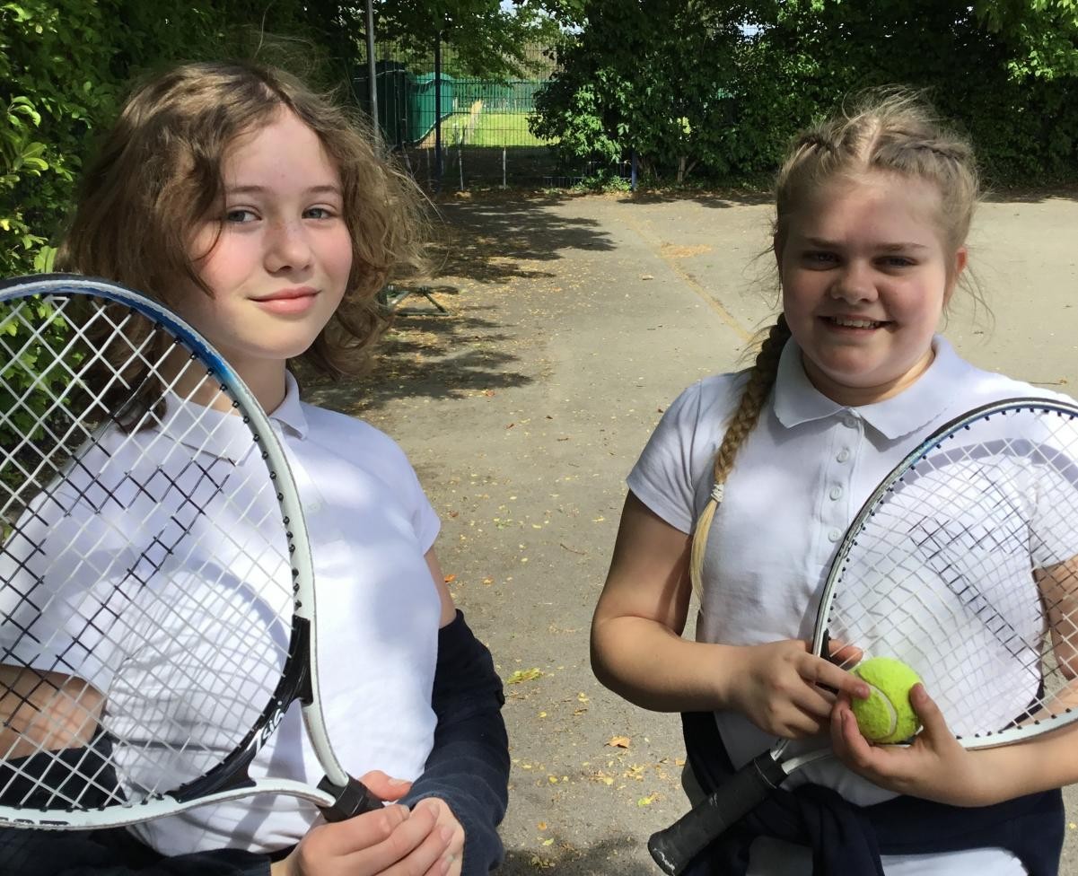 Girls playing tennis