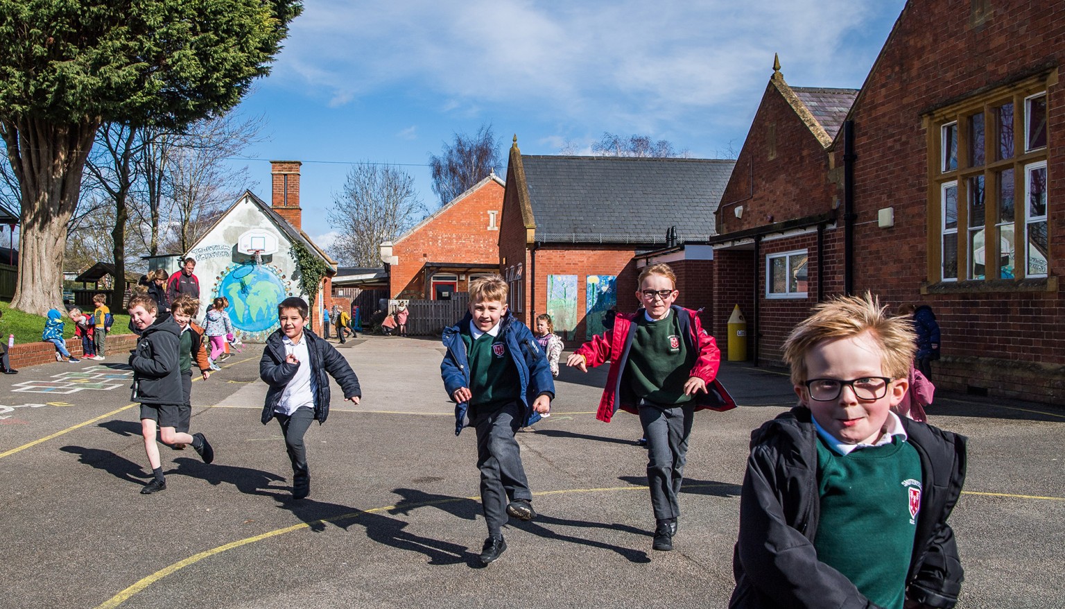 Children running through playground