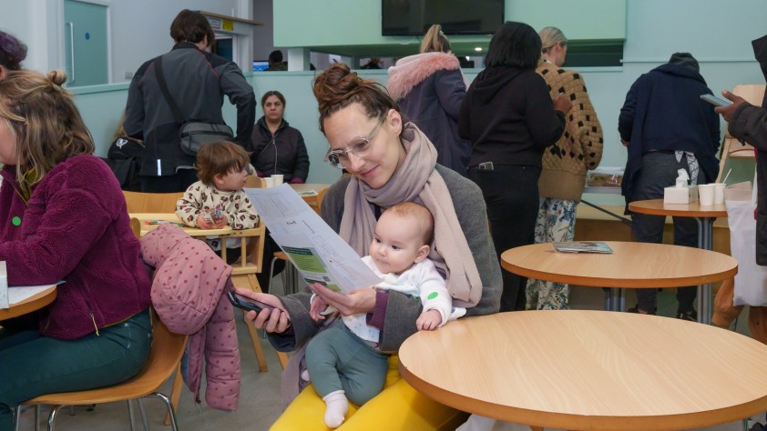 Parent reading a flyer