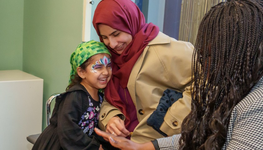 Mother and daughter laughing together