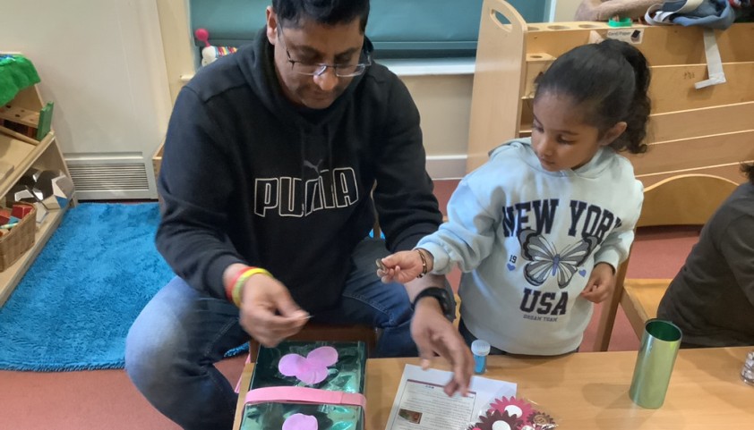 Father and child do arts and crafts together