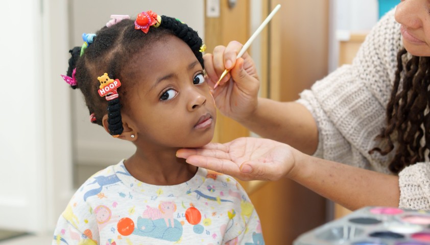 Child gets her face painted