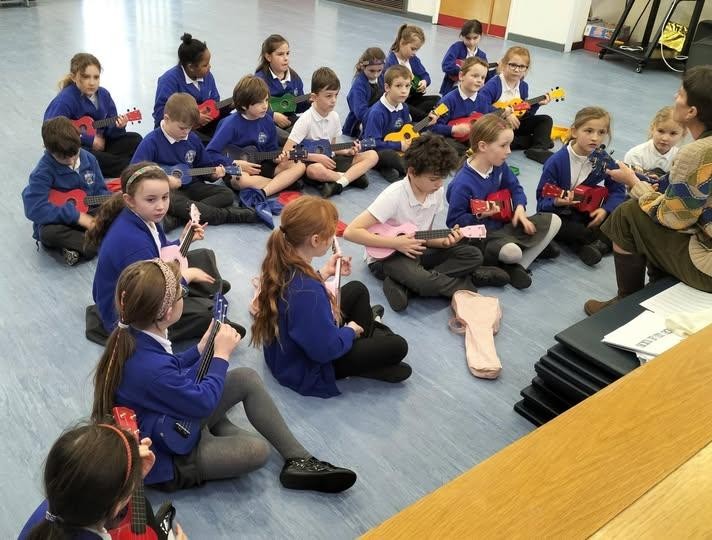 Pengelly working on the First Access programme learning the ukelele