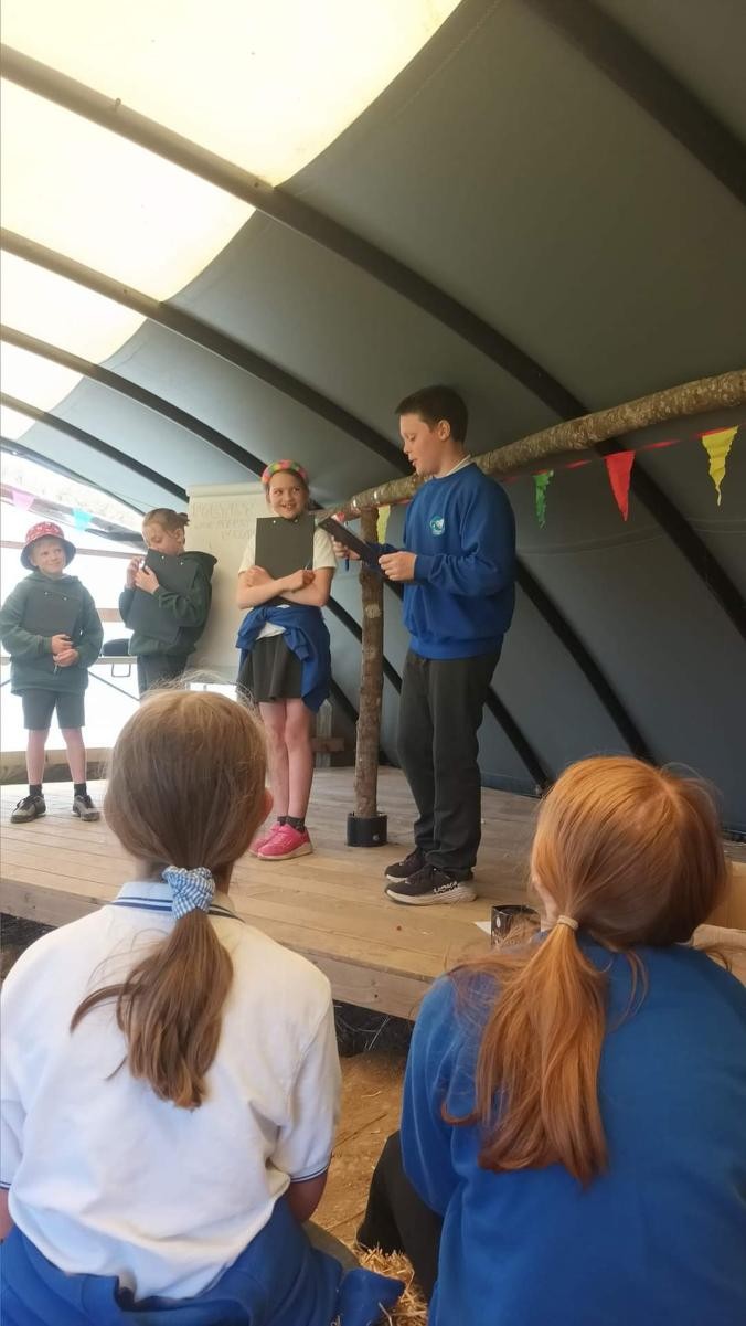 Performing poetry at Kestle Barton Children's Book Festival.