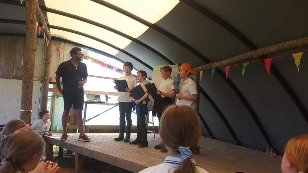 Performing poems at Kestle Barton Book Festival.