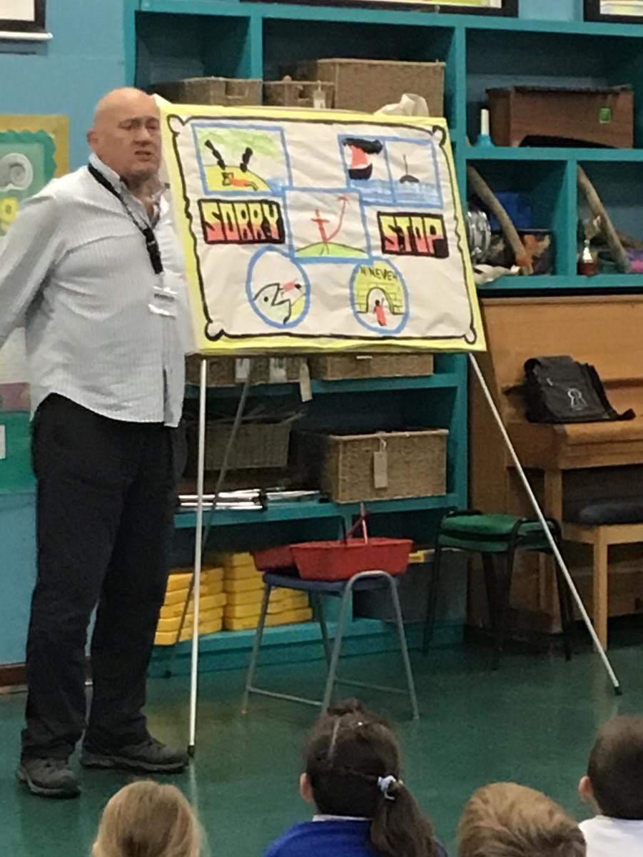 Marten Holmes leading an assembly.