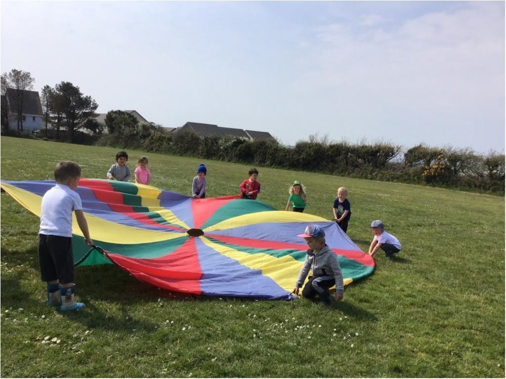 We can visit our school field to play parachute games, run, and this is where we have Sports Day!