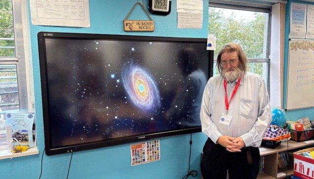 Mr Willmott telling us all about the galaxy and solar system