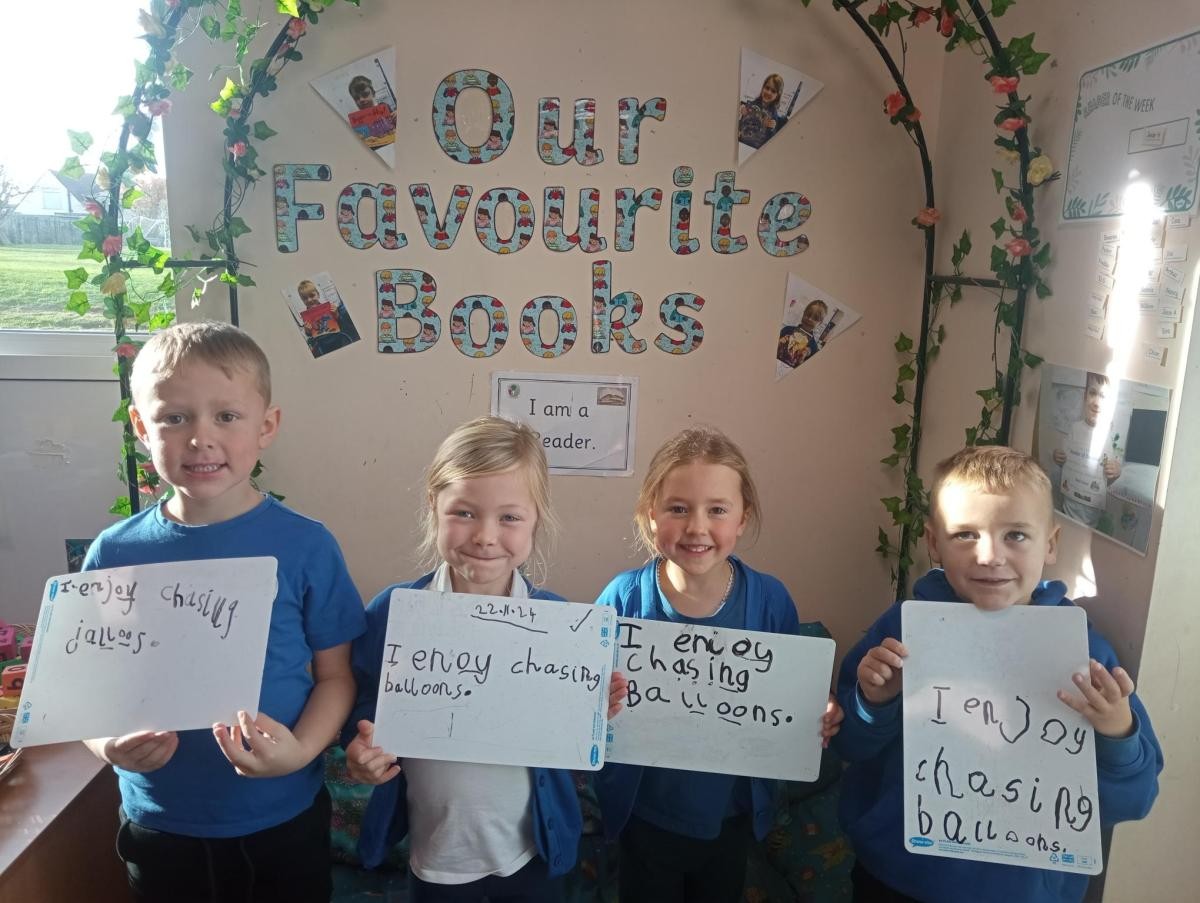 Writing sentences in our phonics session.