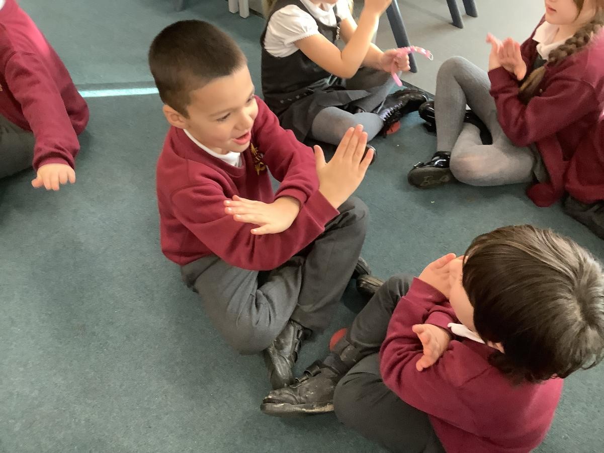 Making up actions to re-tell our English text.