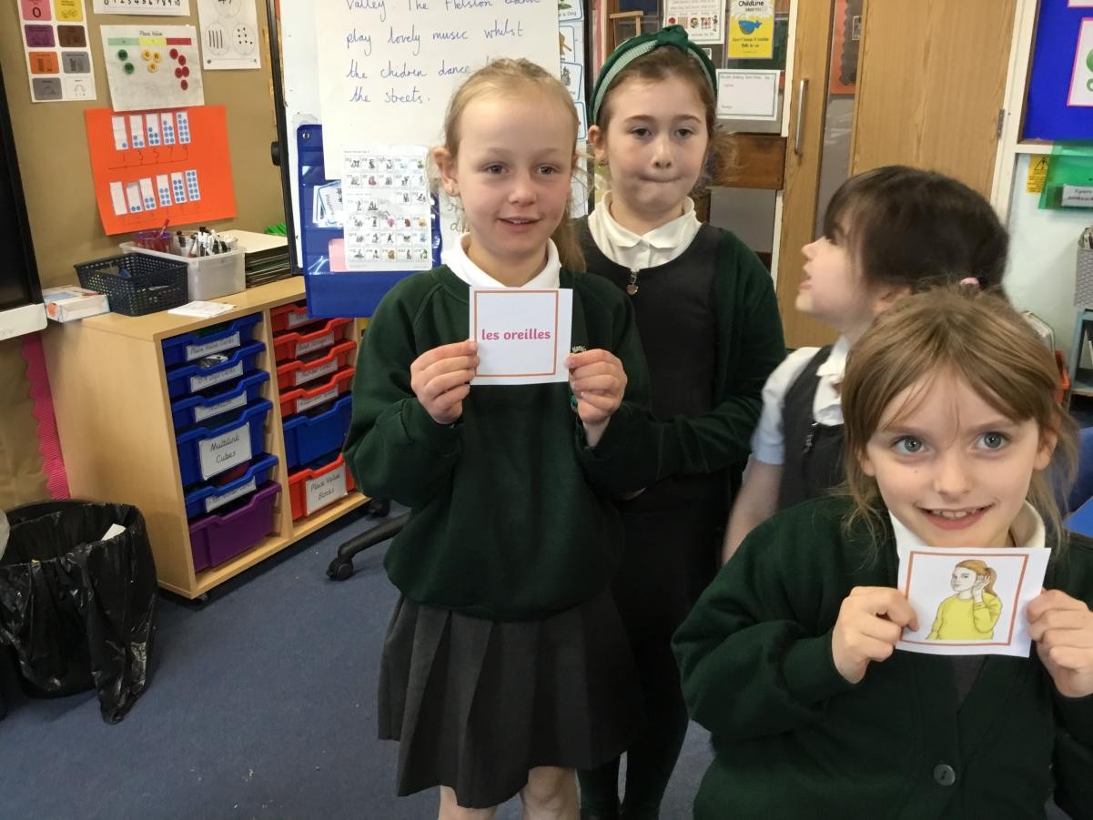 Year 3 learning to sing 'heads, shoulders, knees and toes' in French. 
