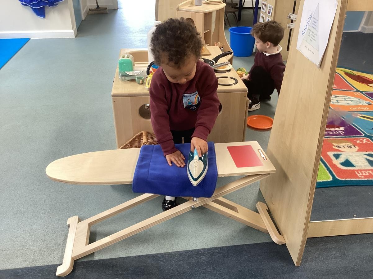 Enjoying role play in our home corner.