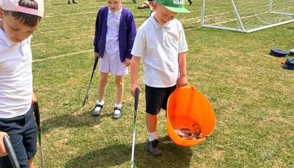 Working hard to keep our school grounds clean and reduce litter.