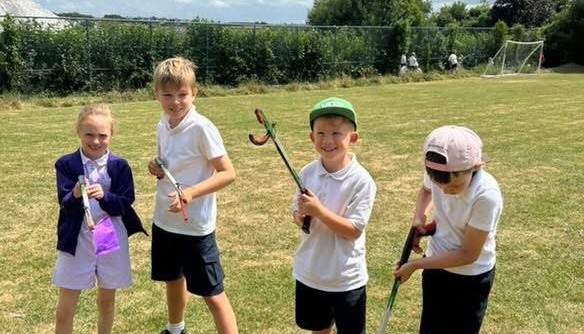 Working hard to keep our school grounds clean and reduce litter.