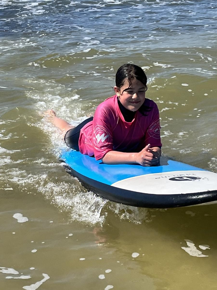Surfing at Polzeath Beach.