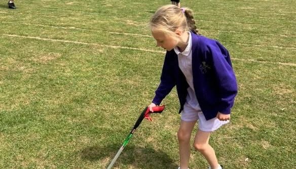 Working hard to keep our school grounds clean and reduce litter.