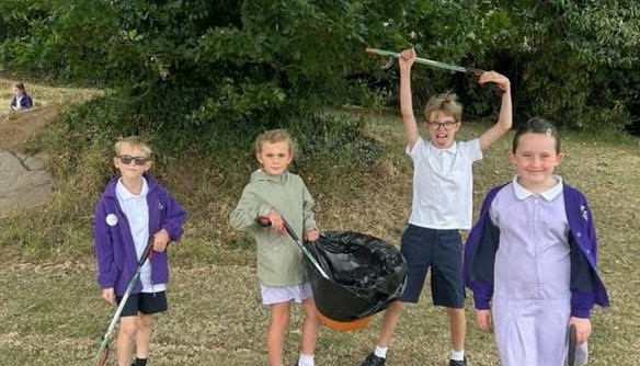Working hard to keep our school grounds clean and reduce litter.