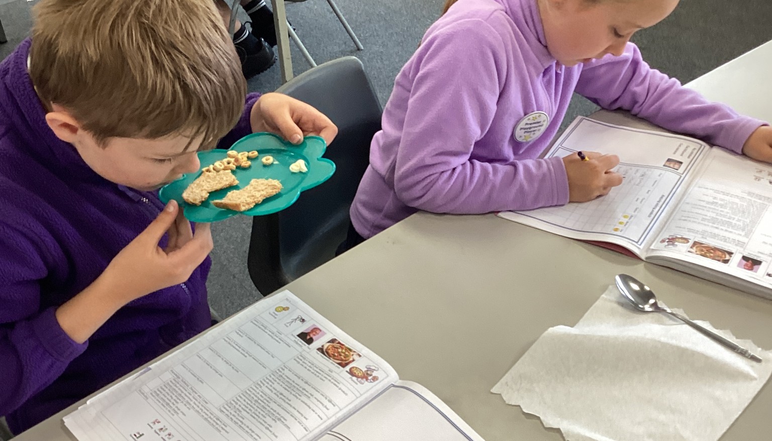 Pupils evaluated a range of existing food products such as bread, cereals, and butter, examining packaging and exploring taste, smell, appearance, and texture to understand what makes a successful product.