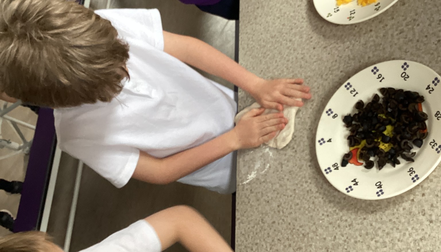 Pupils practised making a pizza base using fresh pizza dough, learning how to shape, stretch, and prepare it ready for toppings. 🍕👏