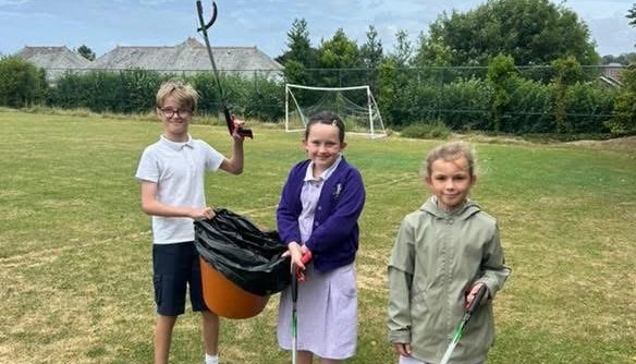 Working hard to keep our school grounds clean and reduce litter.