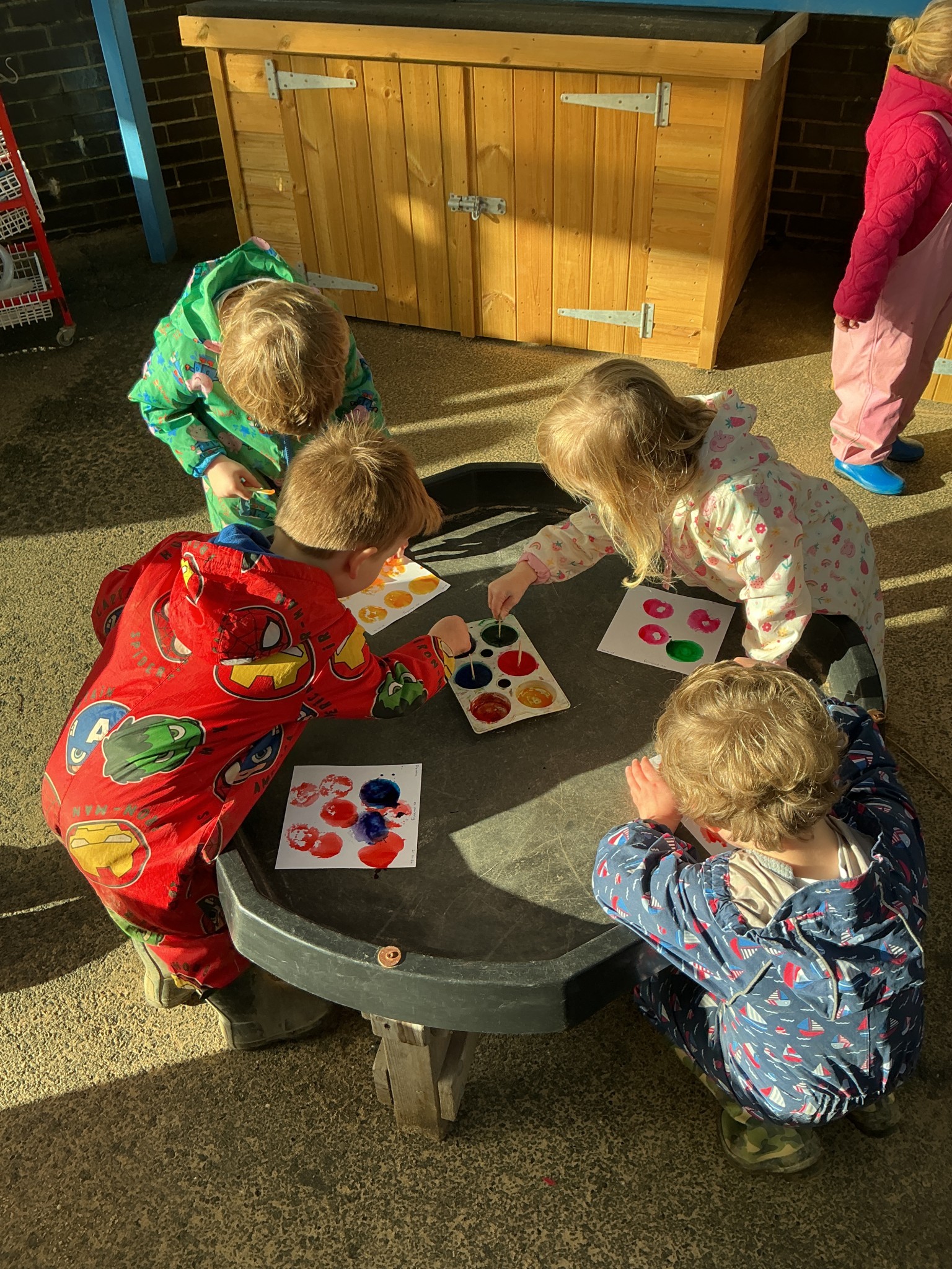 Exploring colours and having fun watching the ice melt.