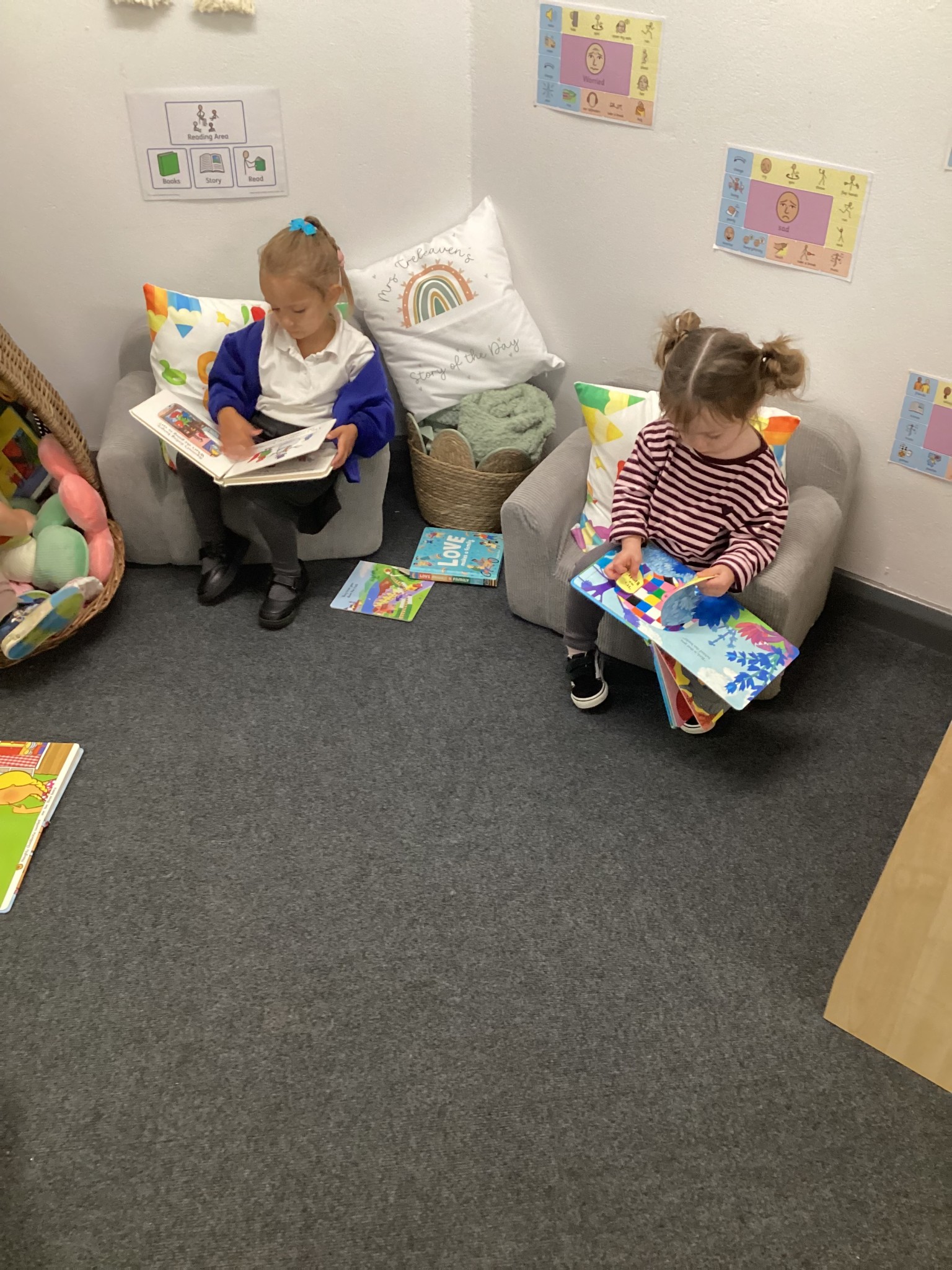 Enjoying stories in our cosy reading corner!