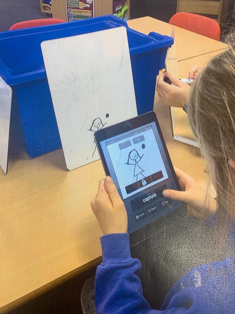 Class 3 using iPads to create animations in an IT lesson.