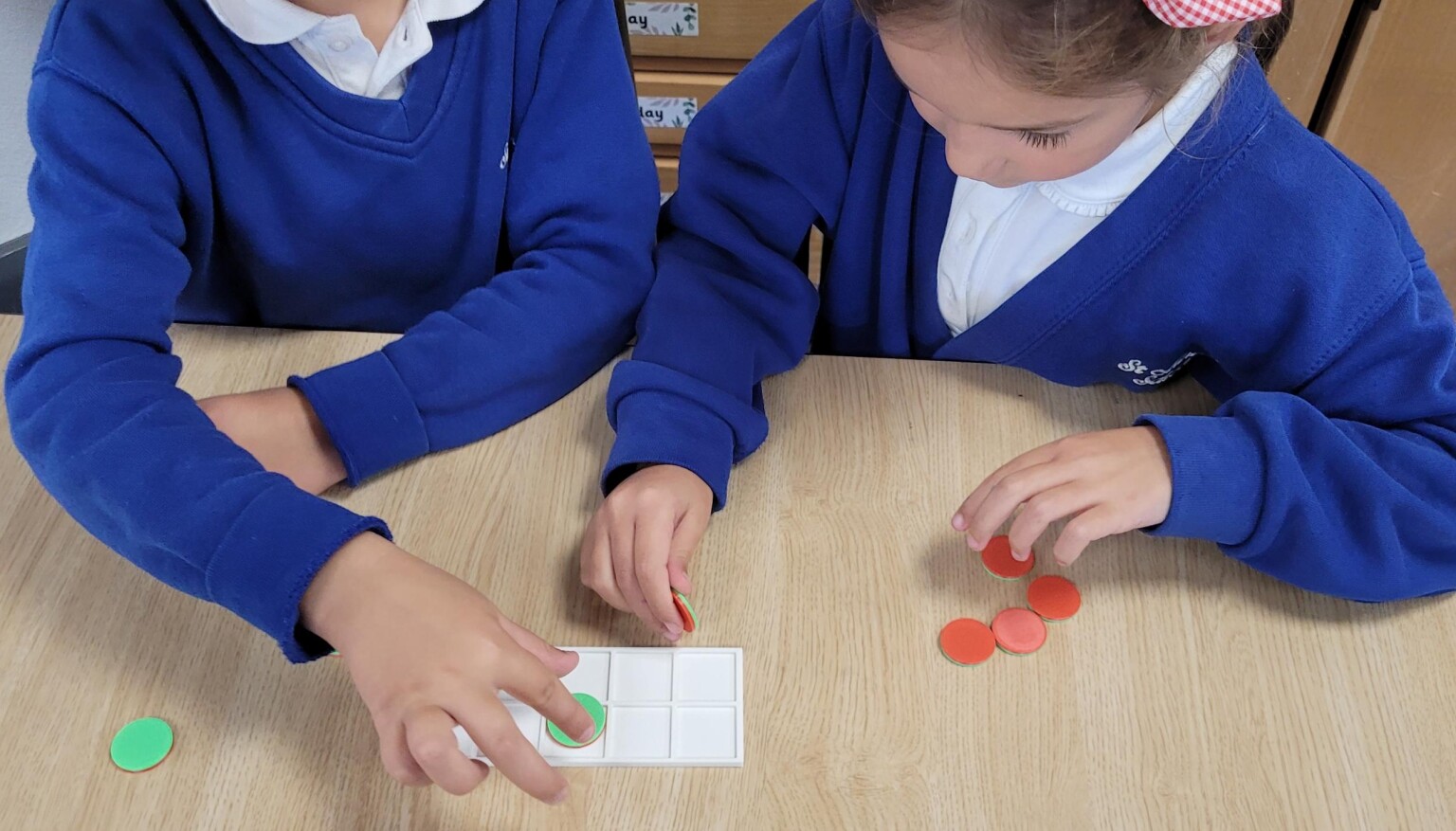 Using tens frame to represent numbers.