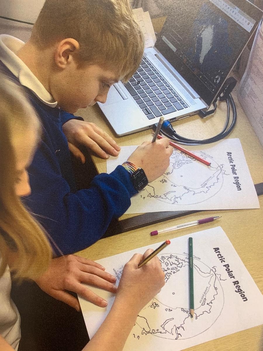 Class 6 using Google Earth on Chrome books to research settlements in the Arctic Circle in Geography.