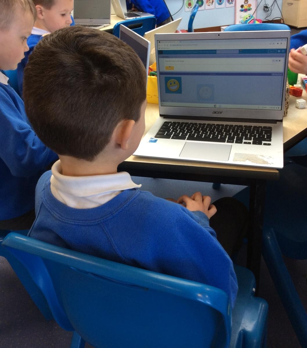 Using a mouse to drag and drop an image.