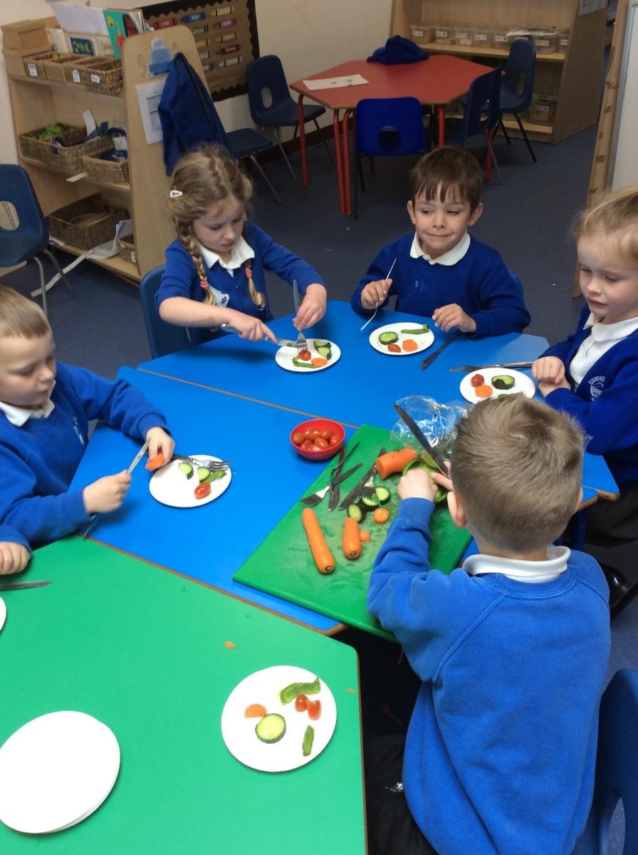 Making vegetable salad and learning about what food makes our bodies healthy. 