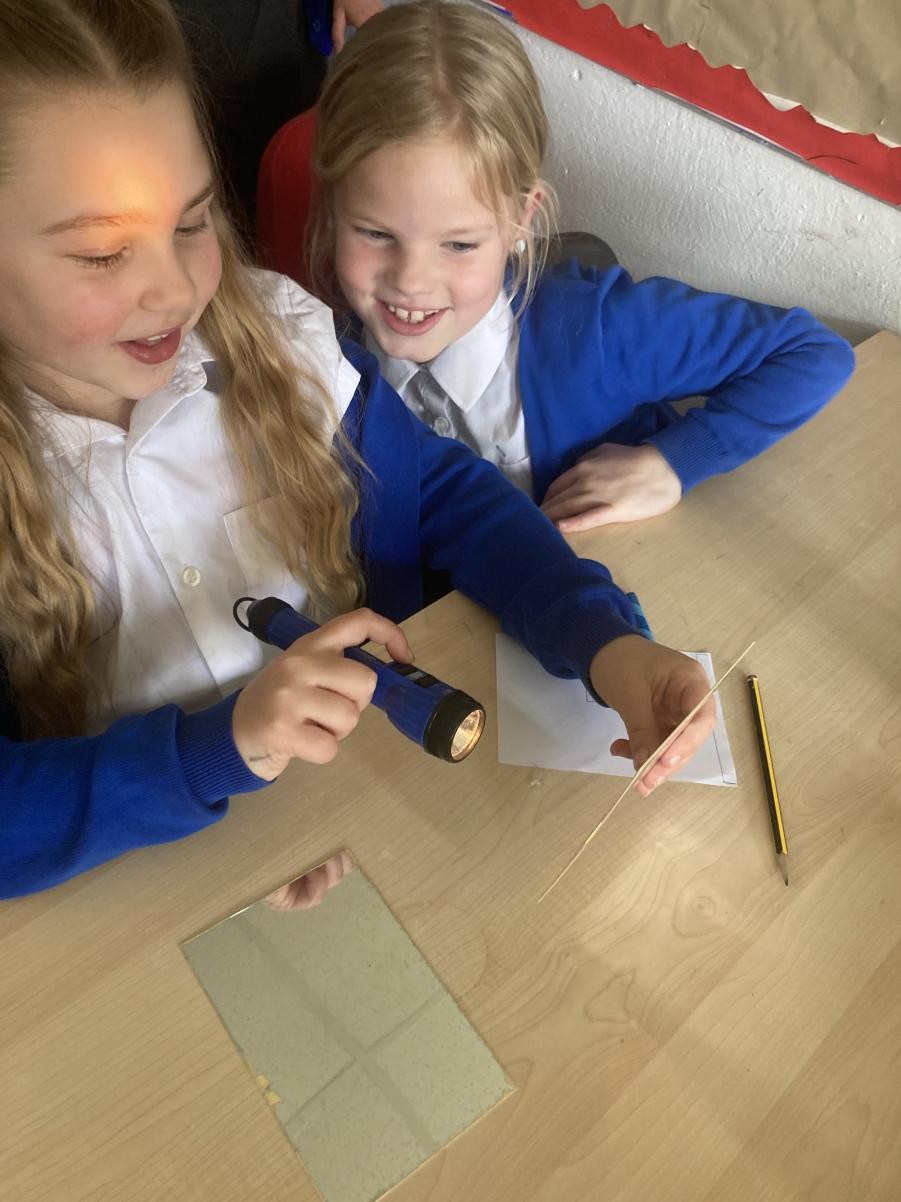 I notice that light is reflected from surfaces. 