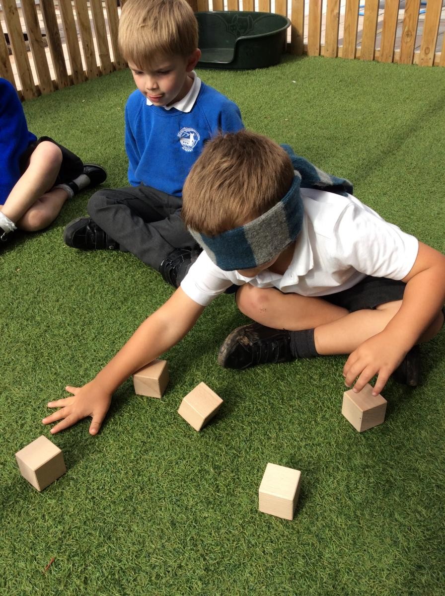 Learning about one of our senses - sight! Children explore ways to build a tower using just their sense of touch. 