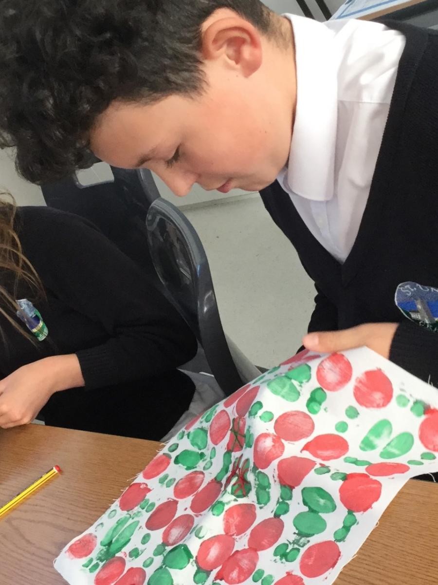 Textiles. Adding stitching and embellishments onto our fabric prints