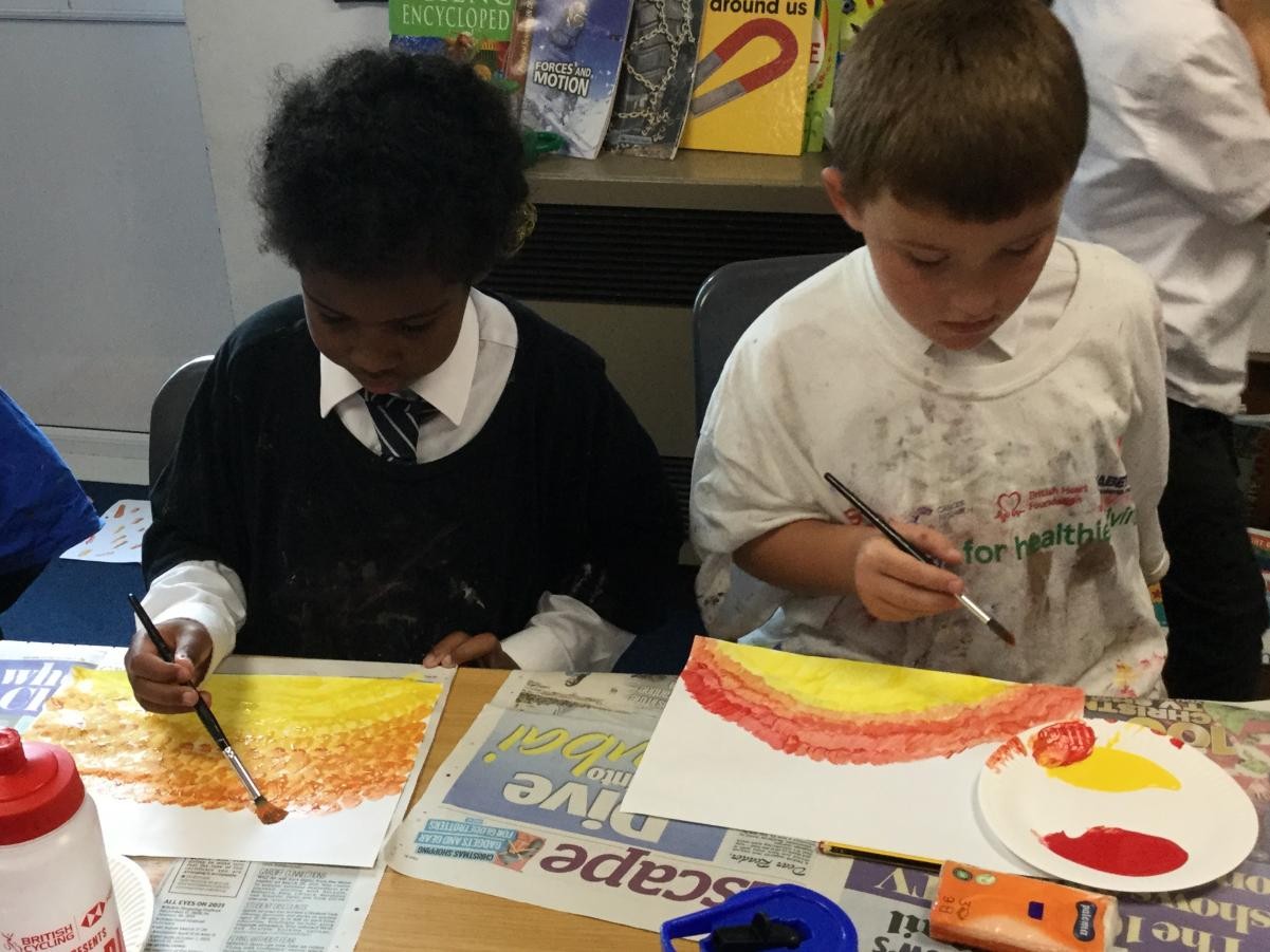 Paint. Mixing warm colours for backgrounds